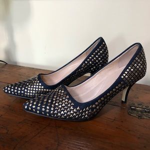 Navy shoes with gold studs.